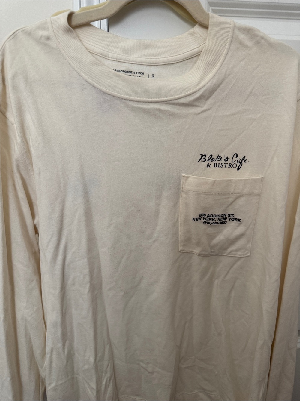 Abercrombie & Fitch Cream Long-Sleeve Pocket Tee with Blake's Cafe Print